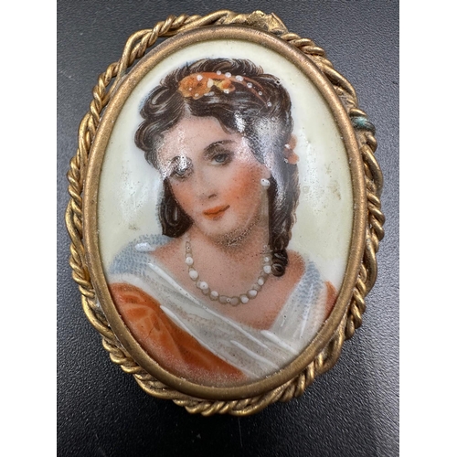 374 - Limoges France porcelain portrait brooch pair from the mid 20th century