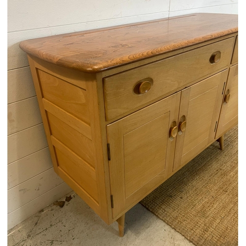 1 - An Ercol sideboard model 351 on short splayed legs (H82cm W123cm D46cm)