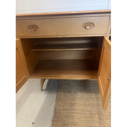 1 - An Ercol sideboard model 351 on short splayed legs (H82cm W123cm D46cm)