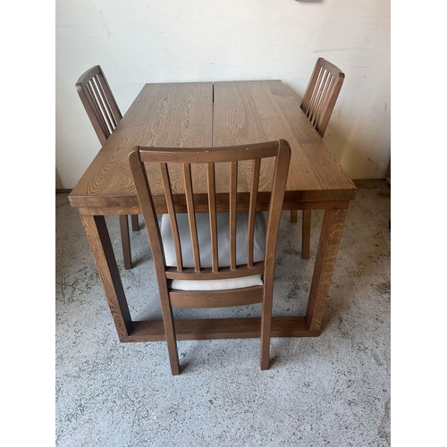 107 - An Ikea plank top style table with three chairs (H75cm W140cm D85cm)