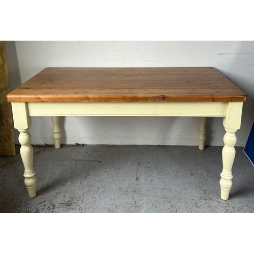 114 - A pine kitchen table with painted legs (H79cm W152cm D90cm)