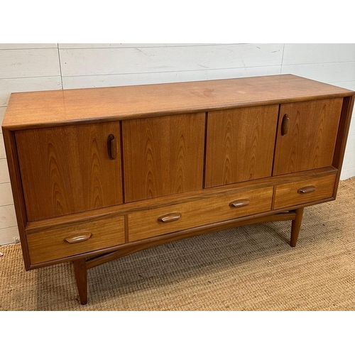 116 - A G-Plan sideboard comprising of two concertina doors and three drawers under (H81cm W145cm D46cm)