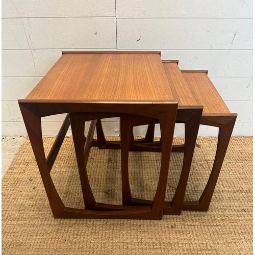 117 - A nest of three Mid Century quadrille tables