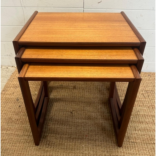 117 - A nest of three Mid Century quadrille tables