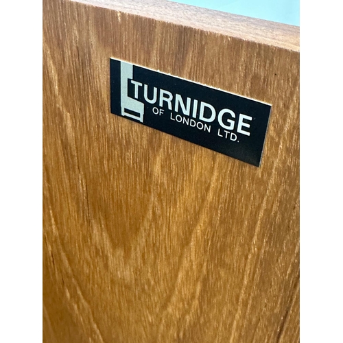 118 - A teak Mid Century mini bar by Turnidge of London (H110cm W76cm D36cm)