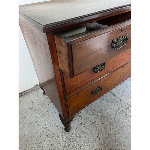 129 - A mahogany low chest of drawers over two long drawers