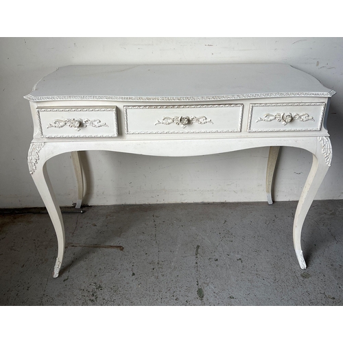 137 - A white Rococo style desk or dressing table (H77cm W104cm D59cm)