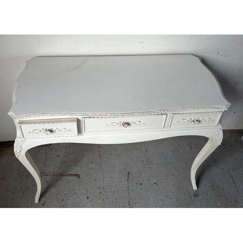 137 - A white Rococo style desk or dressing table (H77cm W104cm D59cm)