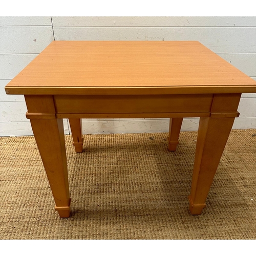 138 - A square contemporary side table on tapering legs (H57cm W66cm D58cm)