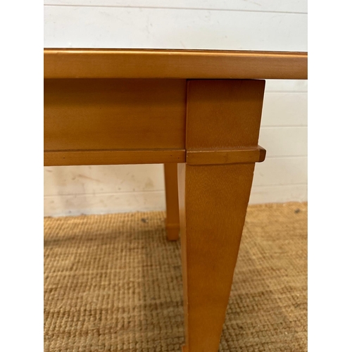 138 - A square contemporary side table on tapering legs (H57cm W66cm D58cm)