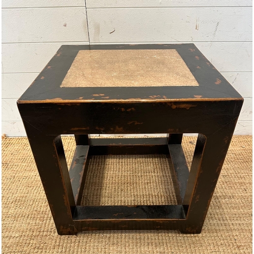 139 - A black hardwood geometric side table with polished stone insert to top (H49cm SQ49cm)