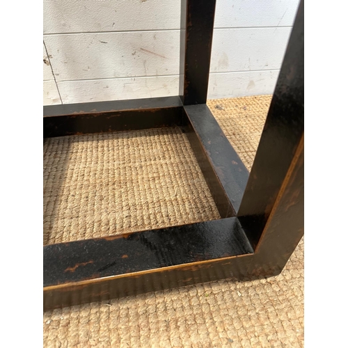 139 - A black hardwood geometric side table with polished stone insert to top (H49cm SQ49cm)