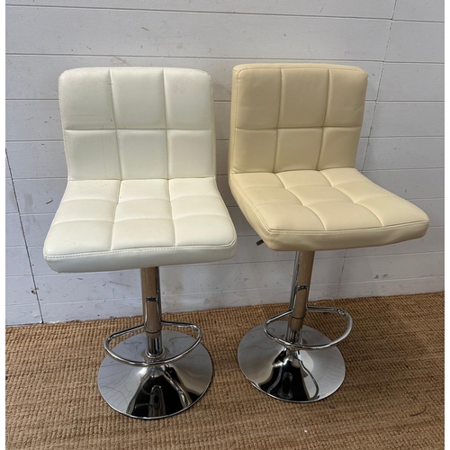 143 - A pair of adjustable white faux leather bar stools on chrome bases