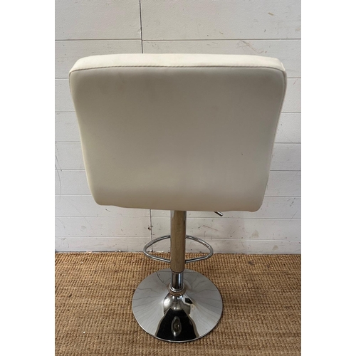 143 - A pair of adjustable white faux leather bar stools on chrome bases