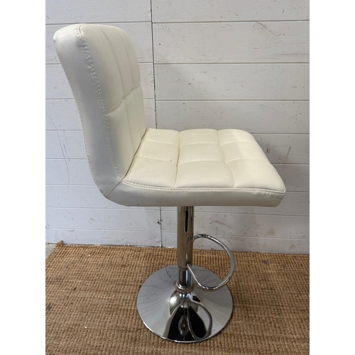 143 - A pair of adjustable white faux leather bar stools on chrome bases