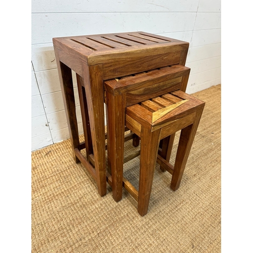 147 - A nest of three contemporary slatted wooden tables (Largest H65cm W44cm D30cm)