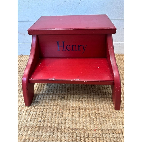 148 - Two personalized children's step footstools, one in red personalized Henry and the other white perso... 