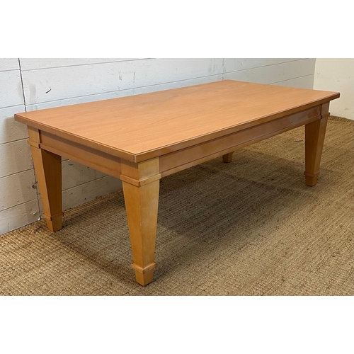 151 - A contemporary coffee table on tapering legs (H46cm W120cm D66cm)