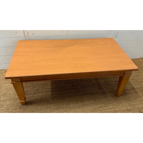 151 - A contemporary coffee table on tapering legs (H46cm W120cm D66cm)