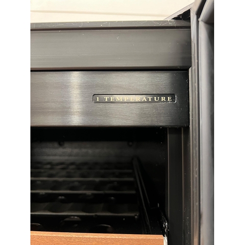 154 - An Eurocave wine fridge with key