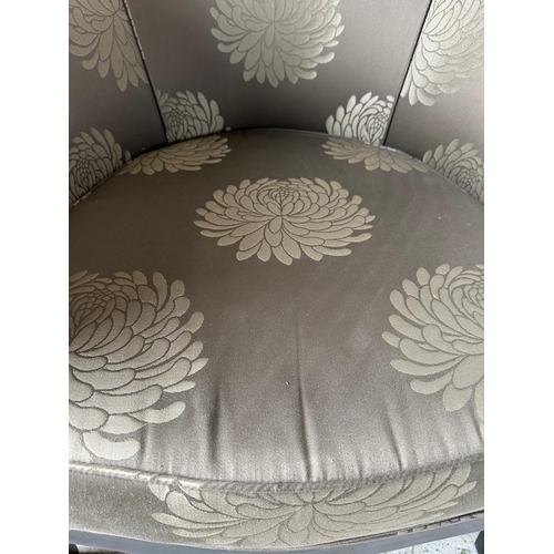 167 - An Art Deco style tub chair, black framed and upholstered in a silver and grey floral upholstery