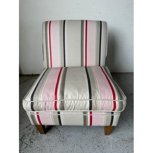 168 - A low lounge chair a striped upholstery