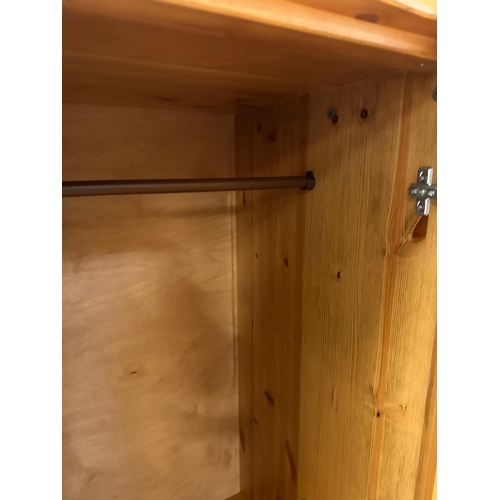 171 - A pine two door wardrobe with three drawers under (H157cm W84cm D52cm)