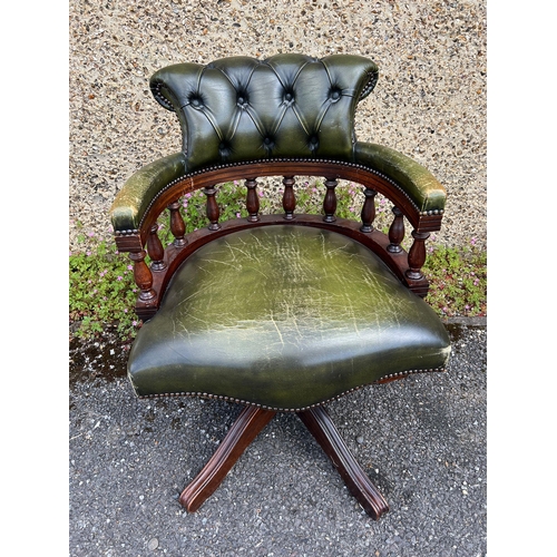 176 - A leather green captain chair