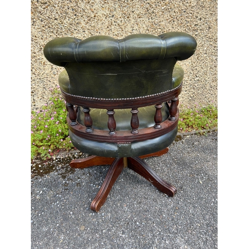 176 - A leather green captain chair