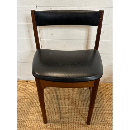 18 - A set of four black leather upholstered McIntosh dinning chairs