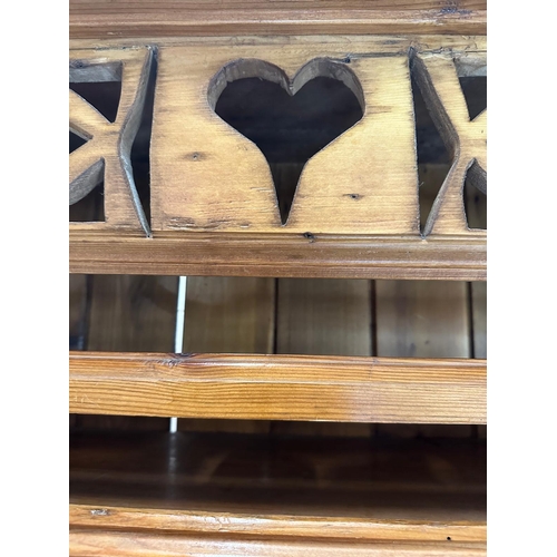 20 - A vintage pine Welsh dresser, three shelf plate rack and two cupboard under