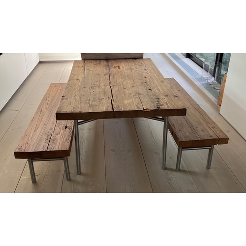 25 - A solid oak reclaimed table with plank top and bench seats on chrome legs (H81cm W180cm D118cm) (Ben... 