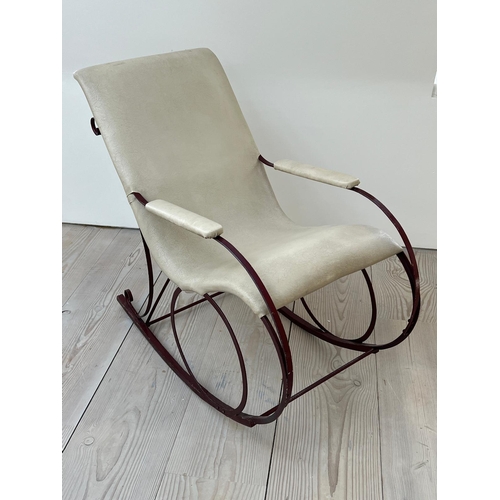 29 - A late Victorian rocking chair, upholstered later (H92cm W102cm D53cm)