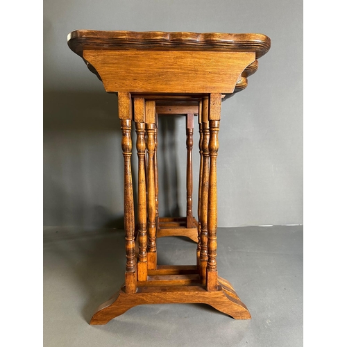 3 - A nest of three regency style tables on turned supports