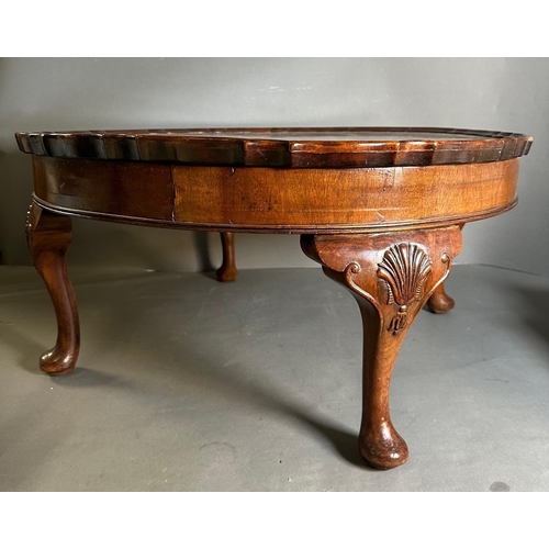 4 - A circular coffee table with pie crust rim on carved cabriole legs (H37cm Dia78cm)