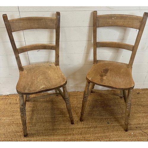 42 - A pair of distressed pine shelf back kitchen chairs on turned legs AF