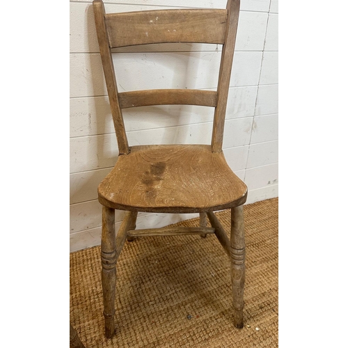 42 - A pair of distressed pine shelf back kitchen chairs on turned legs AF