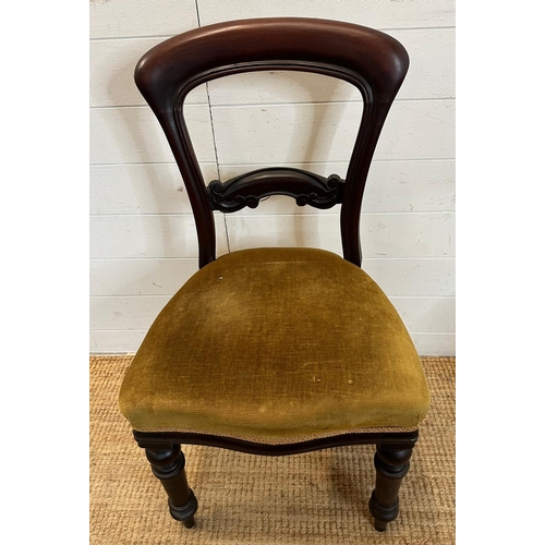 48 - A set of four mahogany Victorian dining chairs upholstered in green