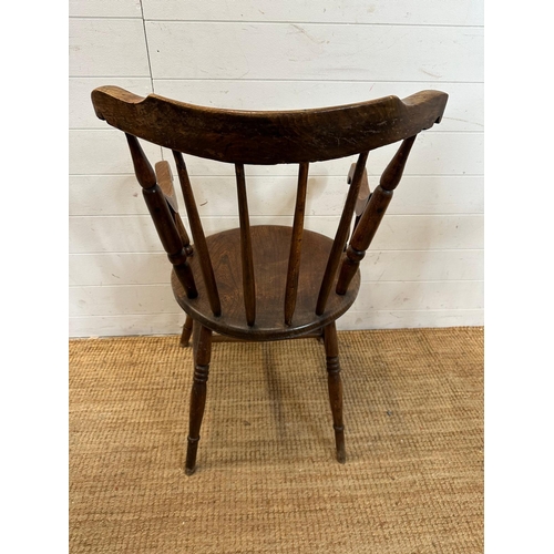 50 - A vintage oak Penny carver arm chair, spindle back and on turned legs