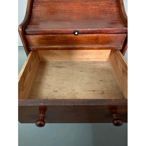 56 - A vintage mahogany two drawer desk tidy in the form of a bureau (H31cm W28cm D24cm)