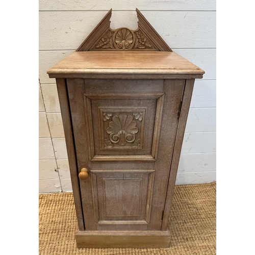 59 - A wooden floor standing side cabinet with carved galleried top and a single shelf cupboard with flor... 