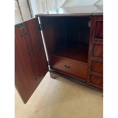 67 - A reproduction media cupboard with four drawers to front (H67cm W86cm D43cm)