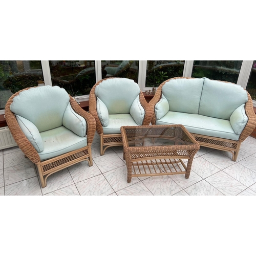 68 - A four piece conservatory suite consisting of two seater sofa, two arms chairs and one table (143cm ... 