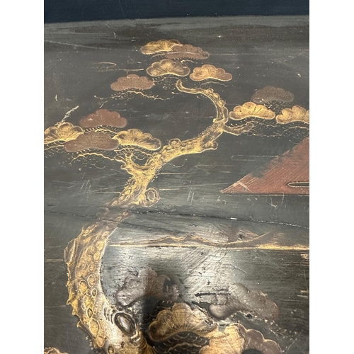 7 - A vintage Japanese butlers tray, black lacquered and with a hand painted gilt scene depicting mount ... 