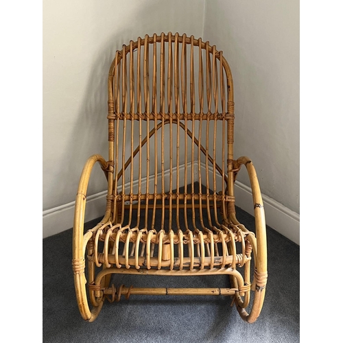 74 - A wicker/cane rocking chair (98cm x 57cm)