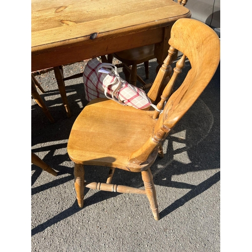 78 - A pine kitchen table with six chairs (H77cm W150cm D79cm)