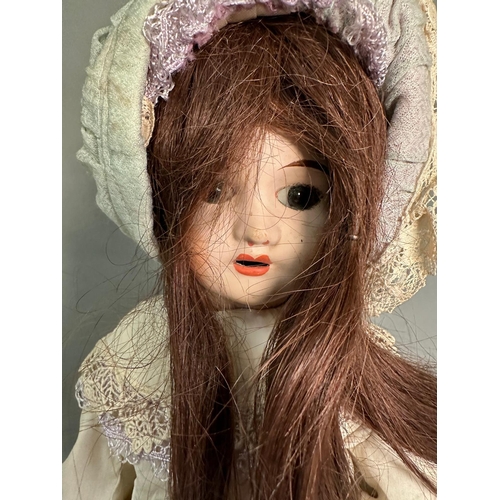 786 - A vintage porcelain doll