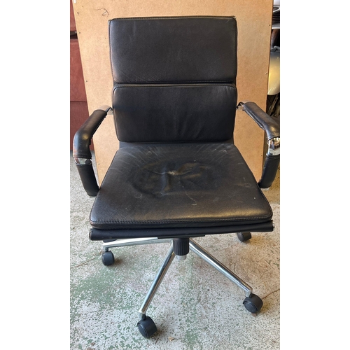 82 - An Eames style leather office chair