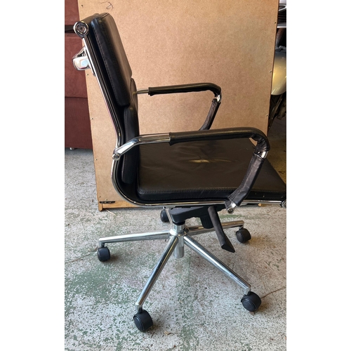 82 - An Eames style leather office chair