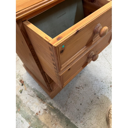 83 - A pine two drawer filing cabinet or deep drawer with a faux drawer front